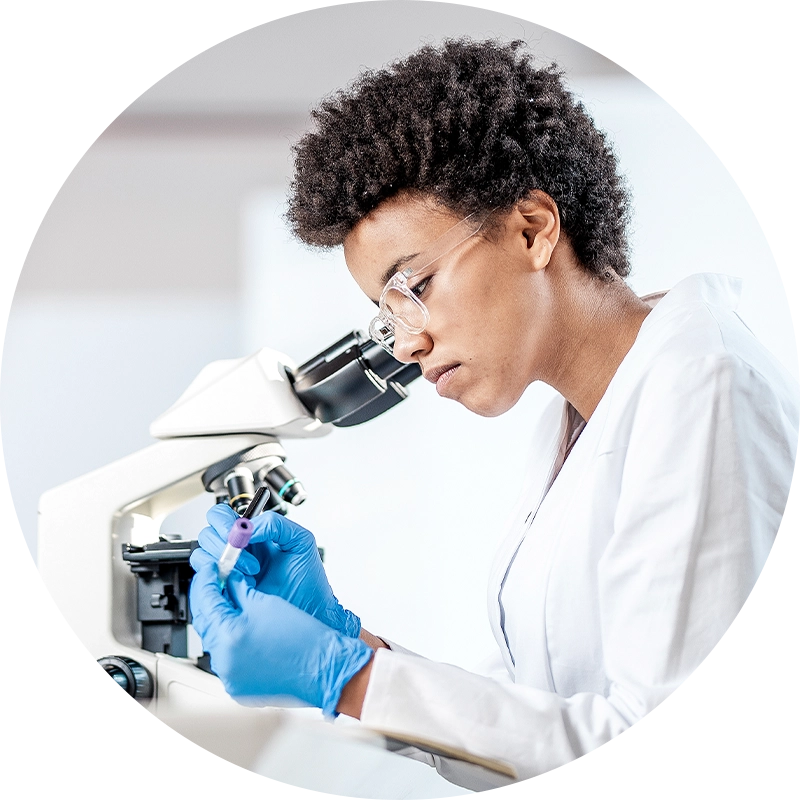 Scientist using a microscope