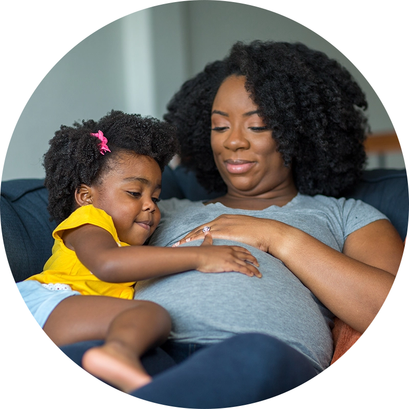 expecting mother with her daughter